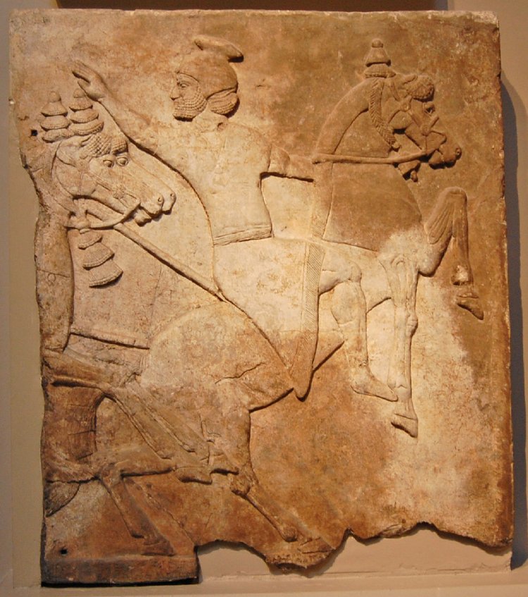 Wall panel relief depicting a horseman attacked by two mounted Assyrians, cr. 728 BC, Neo-Assyrian (Iraq)