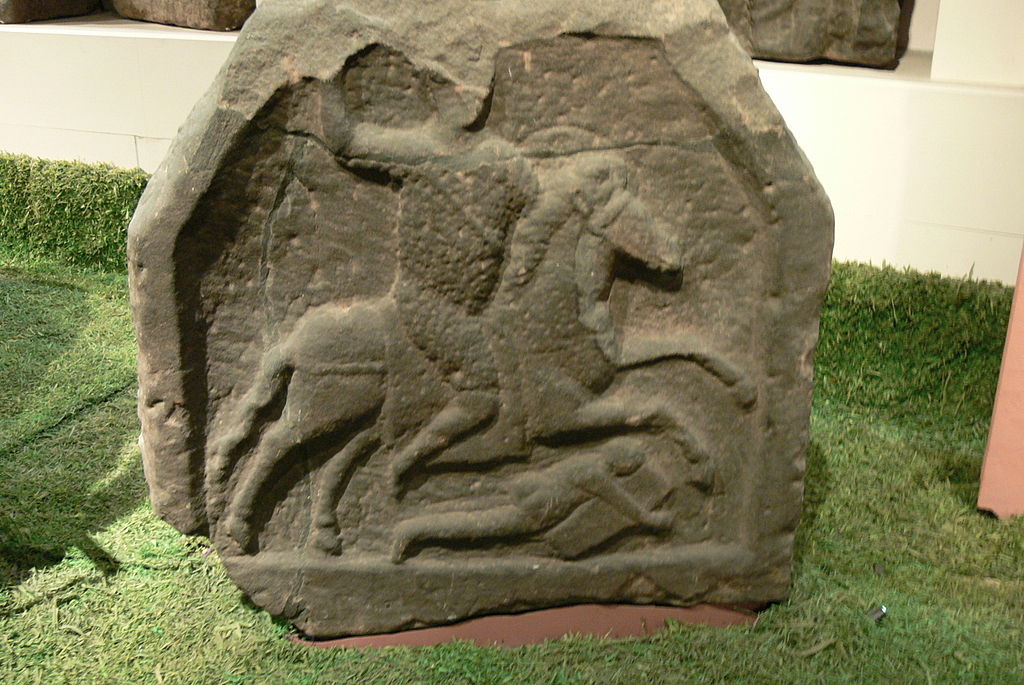 Roman gravestone showing a cavalryman and naked barbarian lying beneath the horse's hooves, ?, discovered in Chester, UK