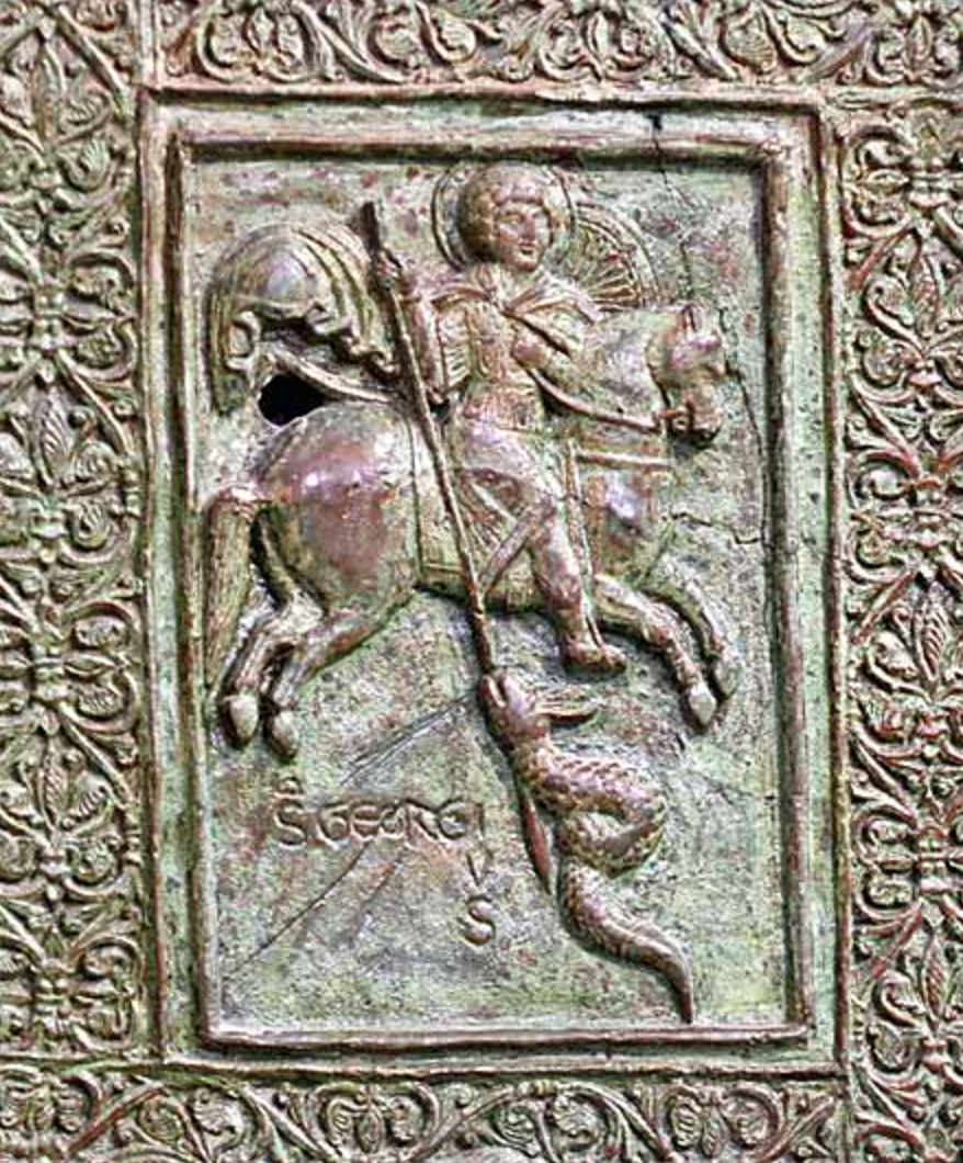 St. George killing the dragon, detail of the main doors, 1185, Trani Cathedral, Puglia