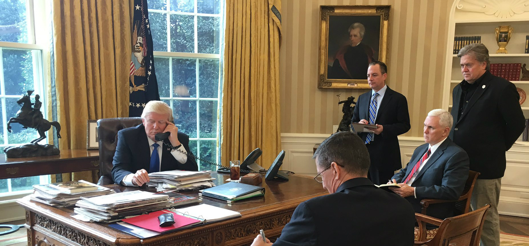 Trump speaking with Putin in Oval Office with statuettes of horsemen on rearing horses in the background, 28 January 2017