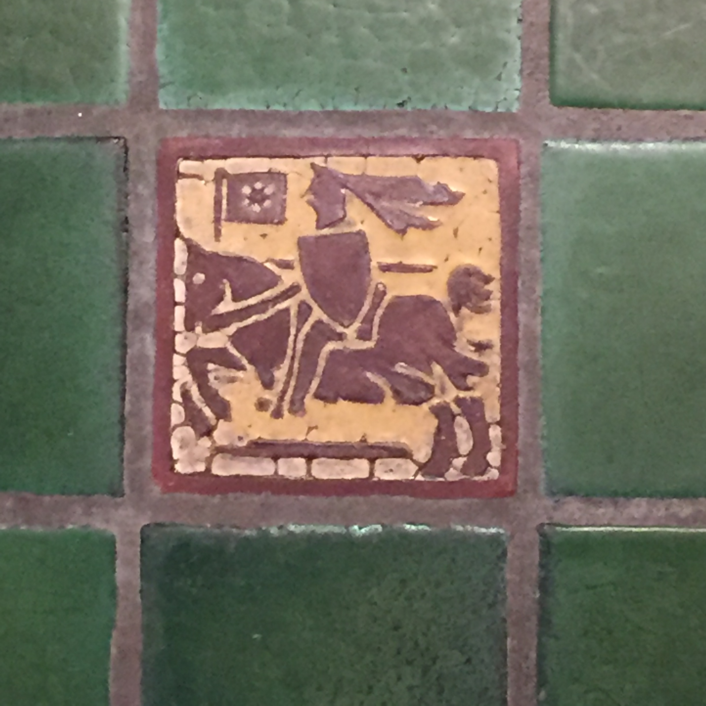 Floor tile showing a knight on horseback (still decorating a floor), cr. 1910, Grueby Faience Company, U.S.A.